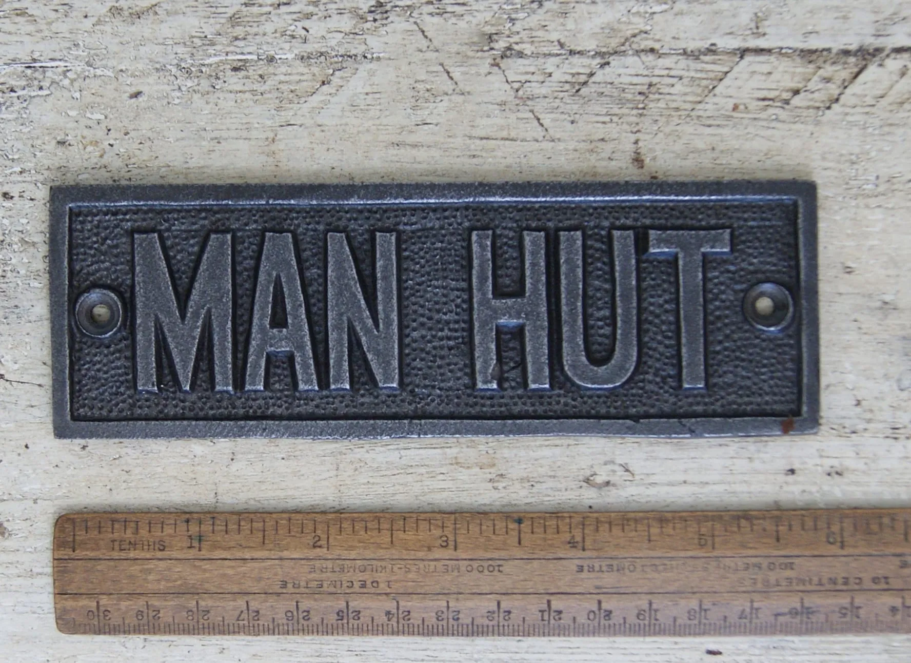 Cast iron plaque Man Hut